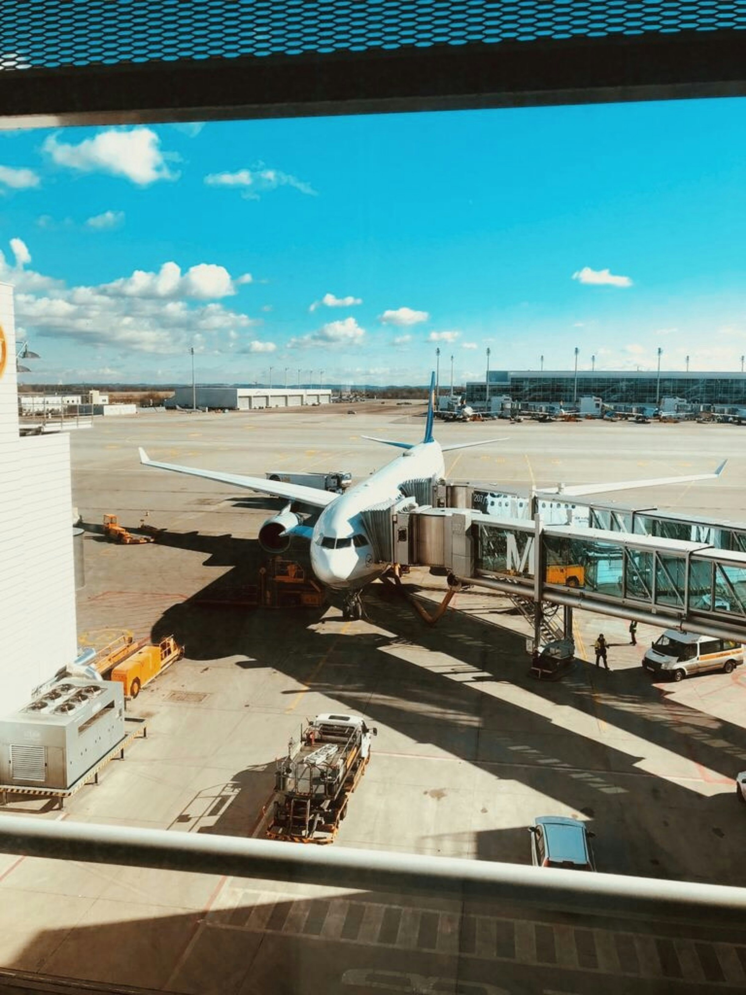 white airplane at the airport during daytime